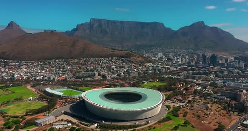 A Drone Flies Over a Modern and Beautiful South African City at Sunset