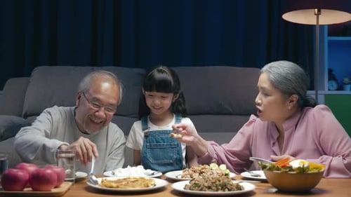 Three Family Members Having Dinner Together