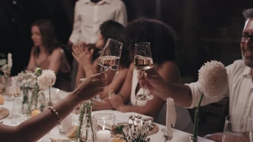 Elegant Dinner Party Toasting Champagne at Night