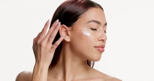 Face, skincare and happy woman in studio with cream, natural cosmetic and wellness for healthy skin