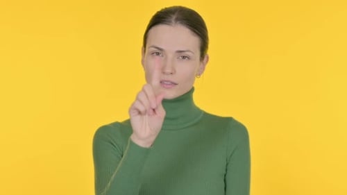 Denying Beautiful Woman Rejecting Idea on Yellow Background