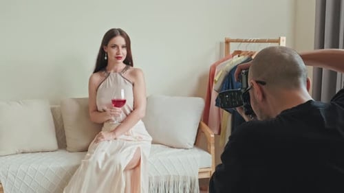 Elegant Woman Posing During Fashion Photoshoot on Couch