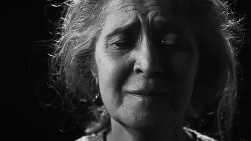 Black and White Portrait of Mourning Elderly Woman