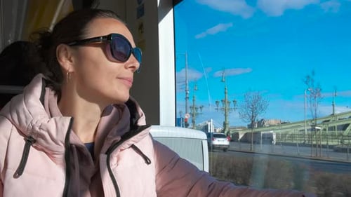 Pensive Passenger Sitting in Tramcar