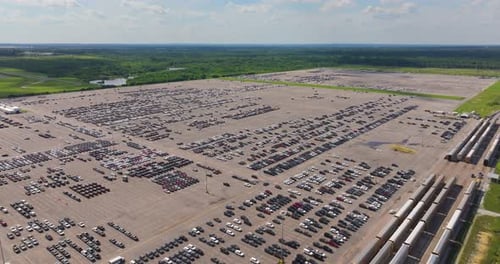 New Cars Parked on Automotive Factory Parking Lot for Worldwide Export Dealer Vehicle Inventory