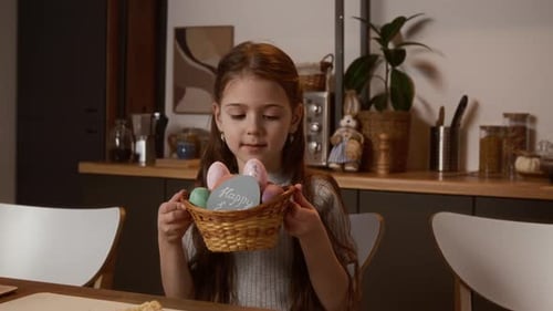 Portrait of Happy Little Girl Posing with Easter Basket at Home