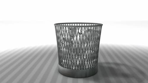 Modern Metallic Wastebasket with Crumpled Paper
