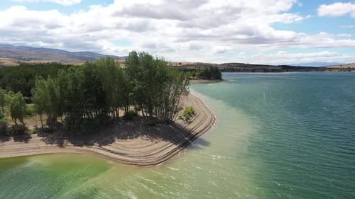 The Shore Of A Dam Lake Whose Water Has Decreased Due To Global Warming