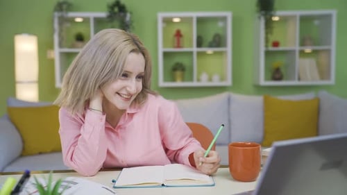 University girl looks at camera and makes positive gesture.