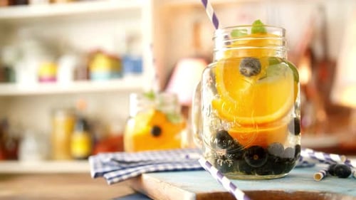 Refreshing Fruit Infused Water in Mason Jar on Kitchen Counter