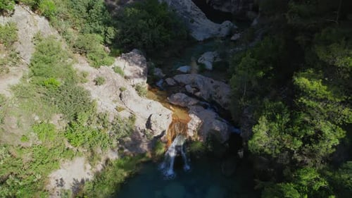 Mountain stream and waterfalls with showy turquoise waters. Panoramic aerial view at dawn. Green Riv