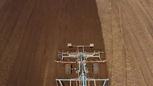 The Tractor Plows the Field Prepares for Crops