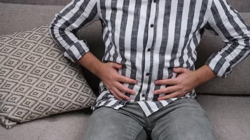 Stomach Pain on Sofa