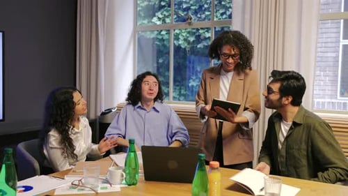 Innovative and Diverse Team Collaboration in a Modern Office Environment for Enhanced Brainstorming