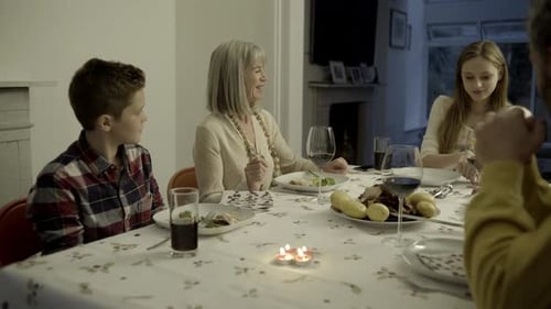 Family Meal with Grandparents and Teenagers Indoors