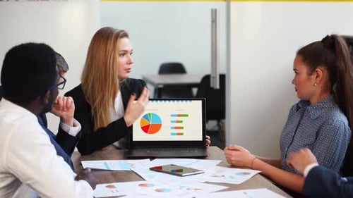 Business Team Analyzing Charts and Graphs