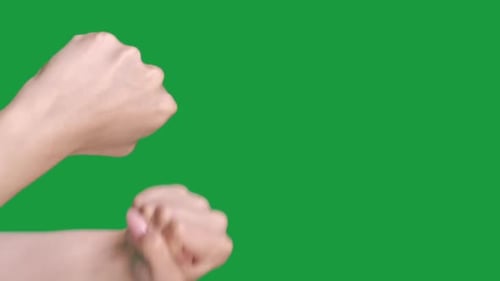 Hands Making Fist Gesture on Green Screen Background
