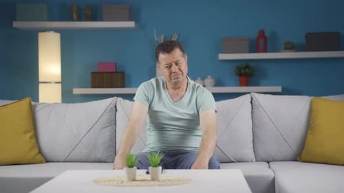 The pessimistic man is confused at home.