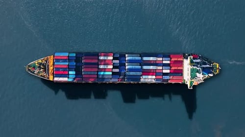 Container ship navigates busy trade routes amid global shipping challenges