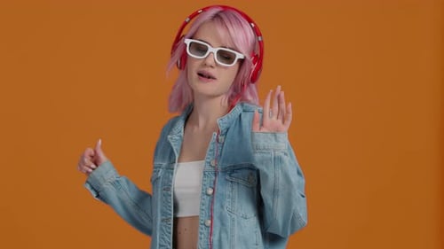 Young Modern Woman 20s in Stylish Denim Jacket and Cropped Top Chewing Gum
