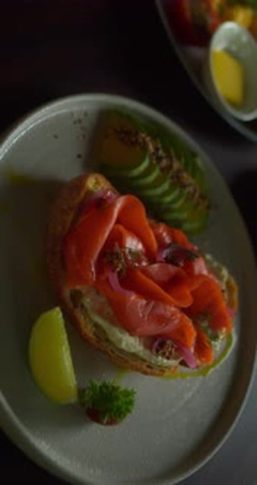 Salmon Toast with Avocado and Lemon Wedge