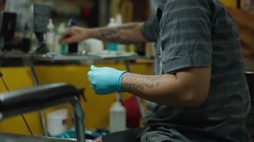 Tattoo Artist Getting the Bamboo Needle Ready to Make a Traditional Tattoo