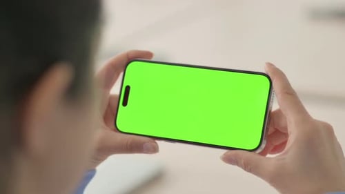 Close Up of Woman Watching Smartphone with Green Screen