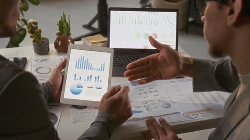 Team Brainstorming Data in Office Workplace