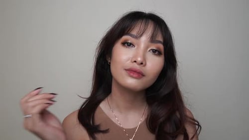 Smiling Woman with Long Hair and Makeup