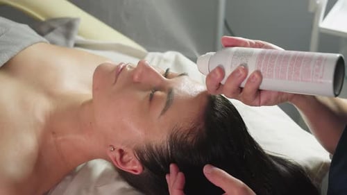 Woman Receives Facial Misting Treatment at Spa