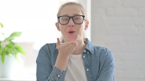 Woman Blowing a Kiss to the Camera