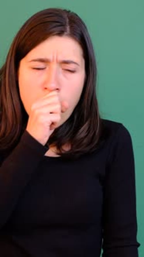Woman Coughing Green Background