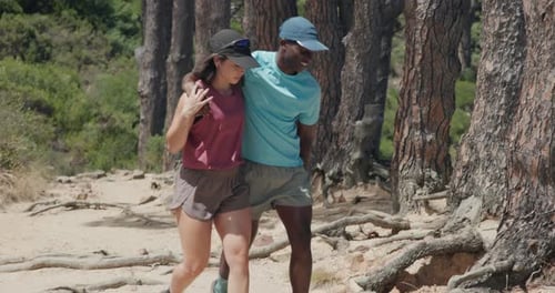 People, hiking and help with injury in forest for sprain, muscle tension or pain on outdoor trail