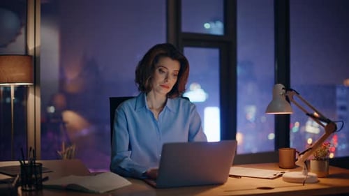 Overtime Manager Looking Laptop Unmotivated to Late Work in Dark Office Closeup
