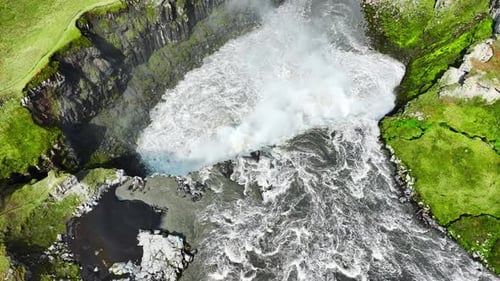 Waterfall in Canyon Mountain River in Summer Sunny Day Nature in Iceland Famous Tourist Attraction