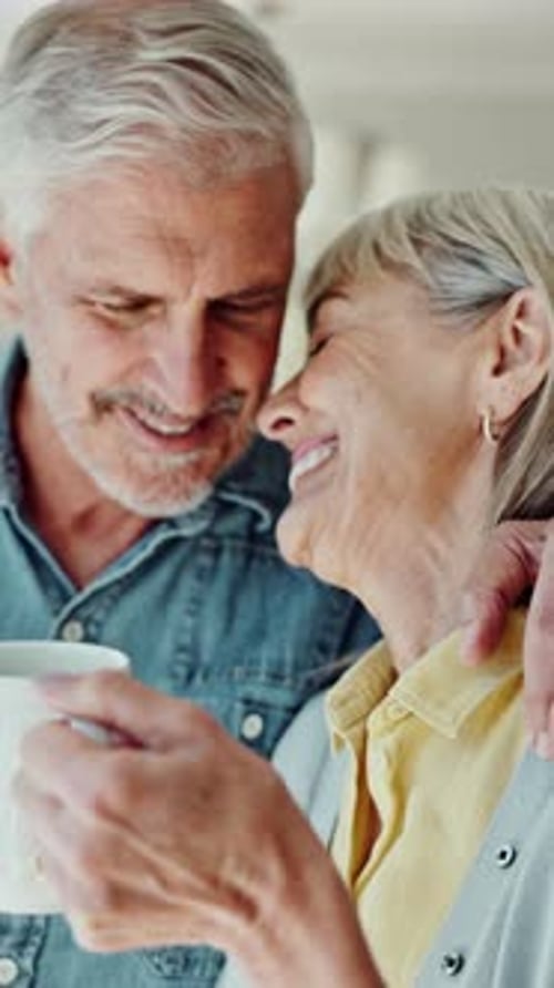 Senior Couple Enjoying Morning Coffee Together at Home