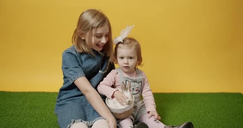 Happy Girls with Easter Rabbit