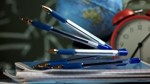 Pens Fall on School Notebooks Filmed on a Highspeed Camera at 1000 Fps