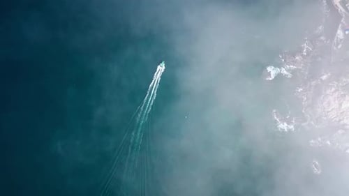 Aerial Top view of a transparent blue sea with beautiful waves at sunny day in summer. air of ocean