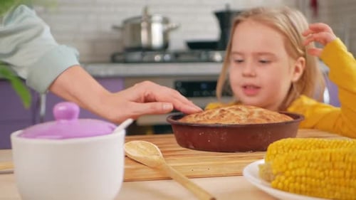 Girl Reaches for Pie, Stopped by Hand