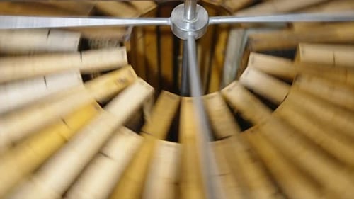 Centrifuge device is spinning to make honey drip away from cells.