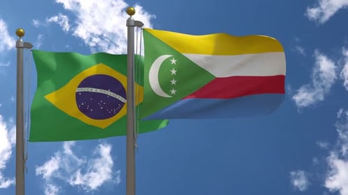Waving Flags of Brazil and Comoros Against a Blue Sky