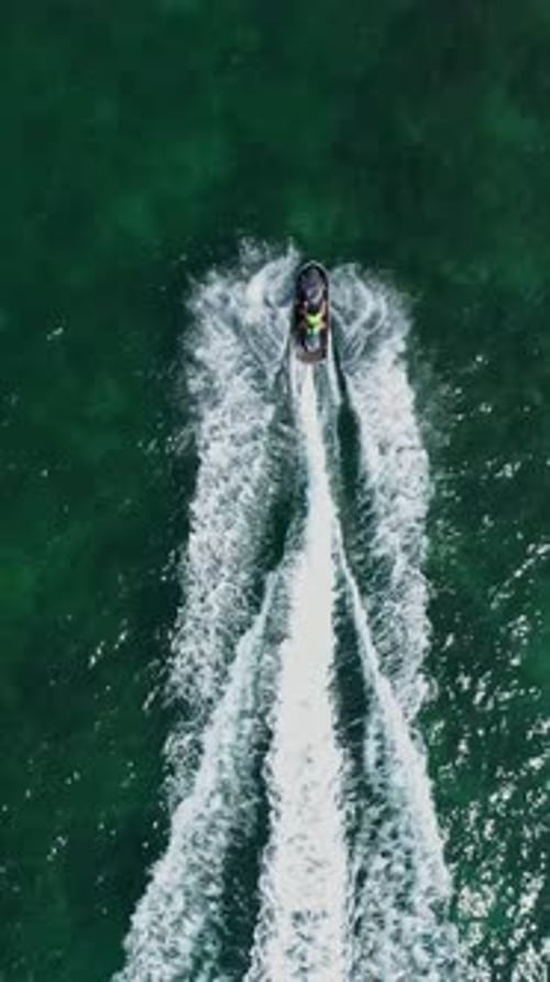 Aerial view to jetski floating in the sea