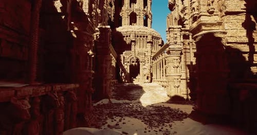 Ancient Carved Temple in a Desert Under Clear Blue Sky at Midday