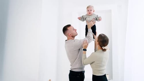 Happy Family Bonding with Baby at Home