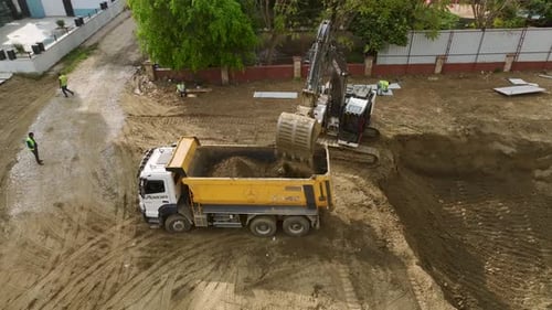Building Foundations Aerial of Excavator Loading Soil