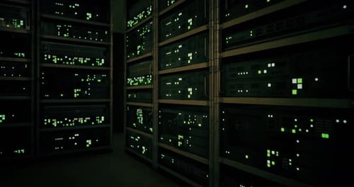 Illuminated Server Racks Show a Network in a Dim Data Center