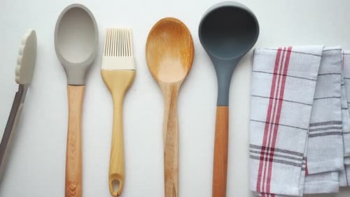 Wooden Cutlery Forks and a Table Cloth on White Background
