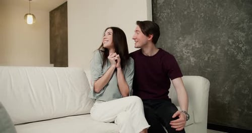 Happy Couple Celebrate New Home Ownership with Keys