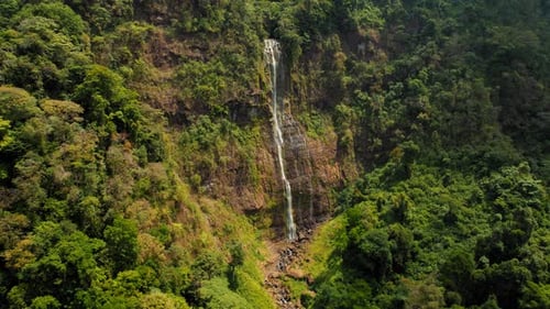 Aerial view of tall Diamante waterfall cascading through tropical jungle cliffs